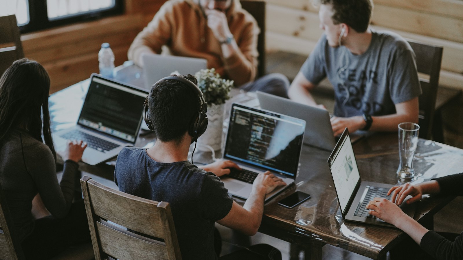 A team working together on laptops